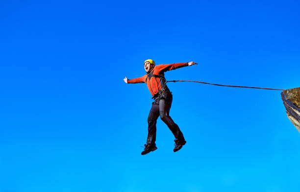 istock Jump off the cliff with a rope. 868848334