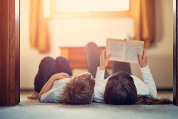 istock Brother and sister reading together 868852684