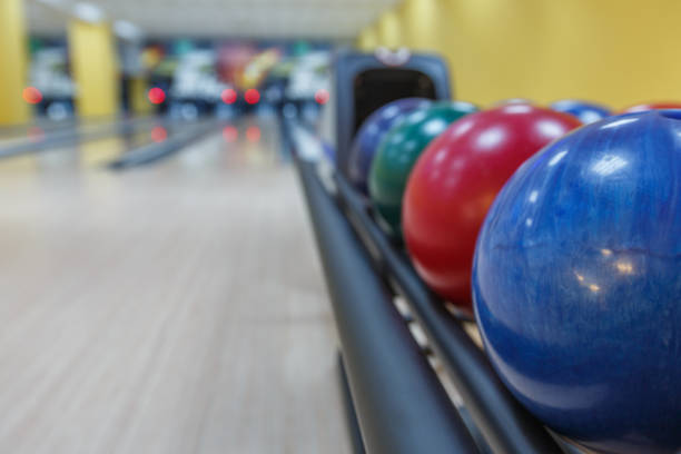 istock Bowling balls return machine, alley background 868853106