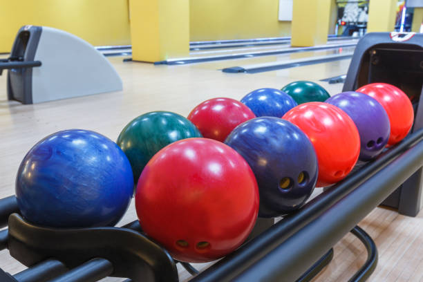 istock Bowling balls return machine, alley background 868853298