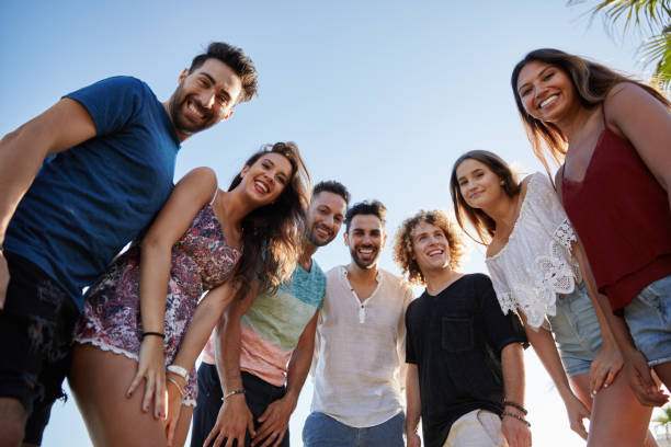 istock Group of friends standing together outside smiling 868853364