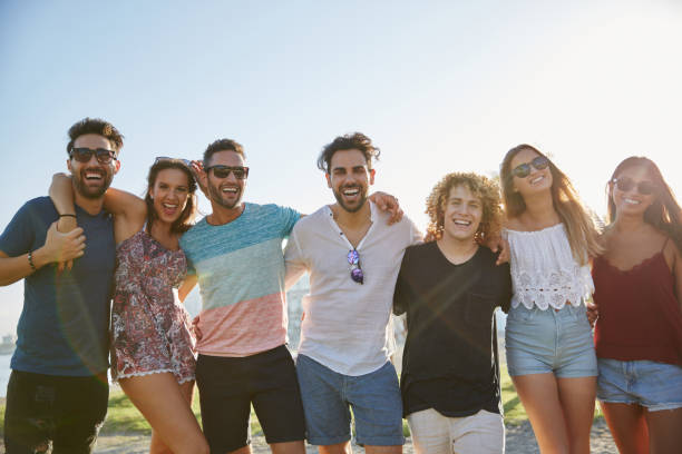 istock Group of friends posing together outside laughing 868853418