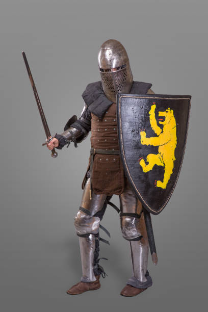 istock Medieval knight with Sword, Shield, Helmet against grey background 868854040