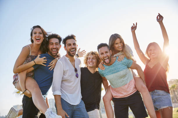 istock Young friends having fun together outside in sunlight 868854202
