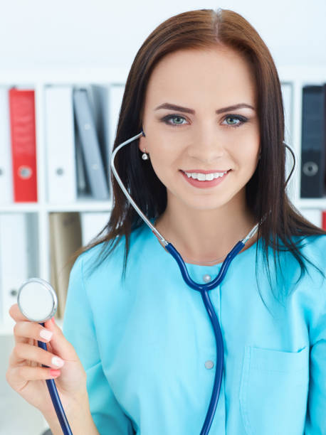 istock Female medicine doctor's hand holding stethoscope's head closeup. Medical help or insurance concept. 868856494
