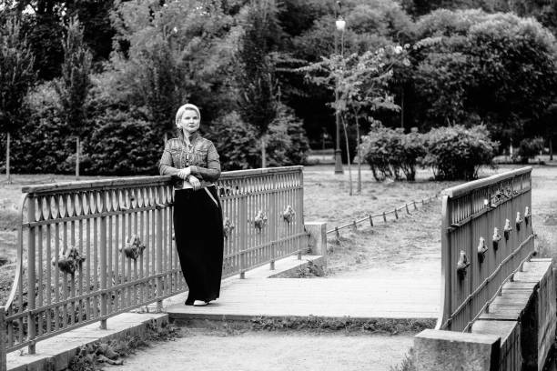 istock Woman is walking in the Park 868856794