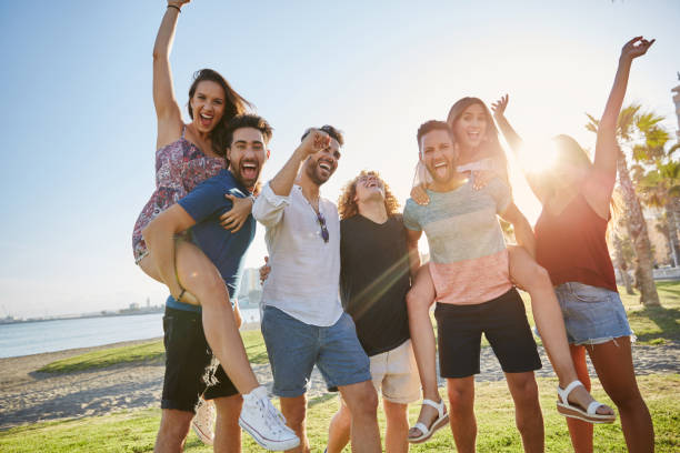 istock Group of friends having fun outside in sunlight 868856912