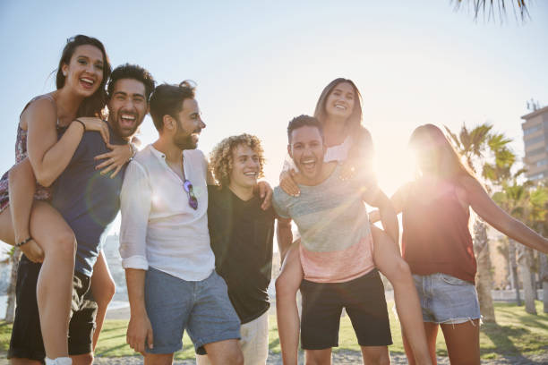 istock Group of young people having fun together outdoors 868857052