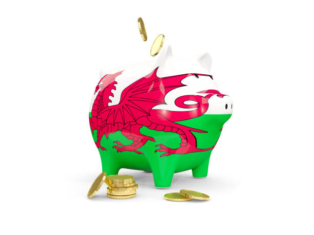 Fat piggy bank with flag of wales stock photo