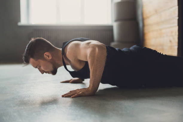 istock Young man fitness workout, push ups or plank 868857606