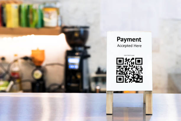 istock Qr code payment , online shopping , cashless society technology concept. Coffee shop accepted digital pay without money , wood stand tag on table. 868857656