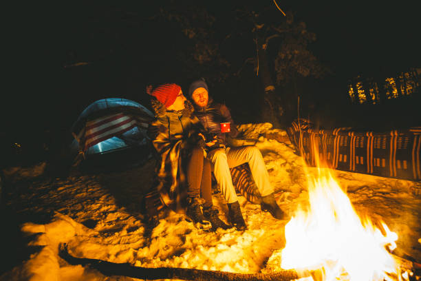 istock Lovely couple sitting next to the fire 868861030