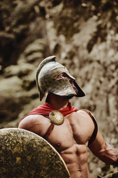 istock Male model in gladiator outfit 868864436