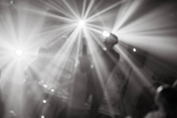 Primary school children dancing on party. Blurred picture. Black and white