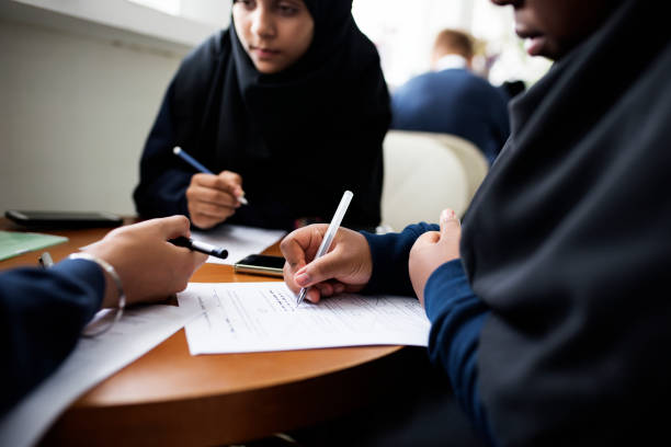 istock Diverse Muslim girls studying in a classroom 868865368