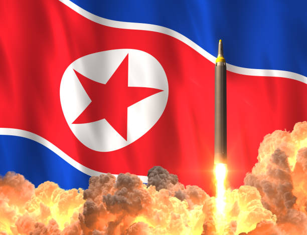 Rocket Launch On The Background Of North Korean Flag stock photo