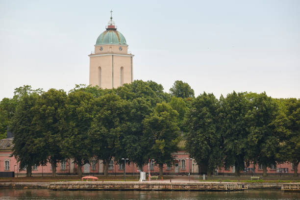 istock Suomenlinna harbor with church and lighthouse dome. Helsinki, Finland. 868871406