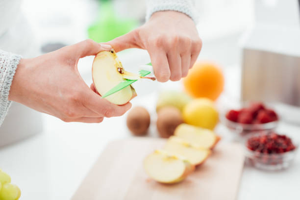 istock Woman cutting apples 868871718