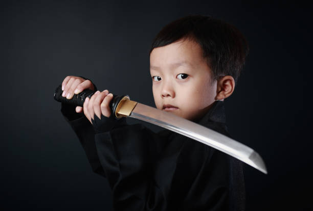 忍者の衣装を着た少年 - samurai katana chinese ethnicity men ストックフォトと画像