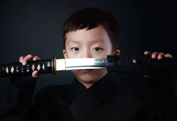 忍者の衣装を着た少年 - samurai katana chinese ethnicity men ストックフォトと画像