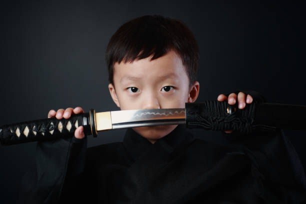 忍者の衣装を着た少年 - samurai katana chinese ethnicity men ストックフォトと画像