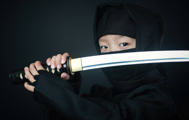 忍者の衣装を着た少年 - samurai katana chinese ethnicity men ストックフォトと画像