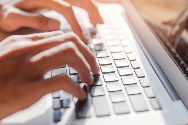 istock Working at home with laptop computer woman writing a blog 868873220
