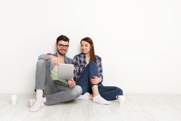 istock Team work at home with pleasure, couple with digital tablet 868873686