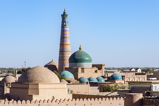 Islam Khoja Minaret and moque in Itchan Kala, the inner town of the city of Khiva - Uzbekistan