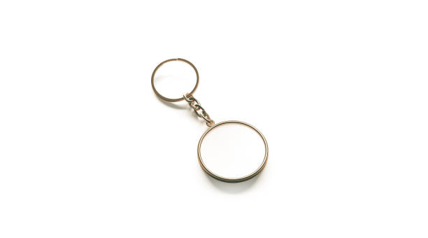 istock Blank golden white key chain mock up side view, 3d rendering 868880212