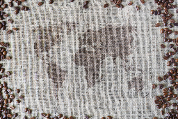istock Burlap texture with coffee beans border and world map 868883414