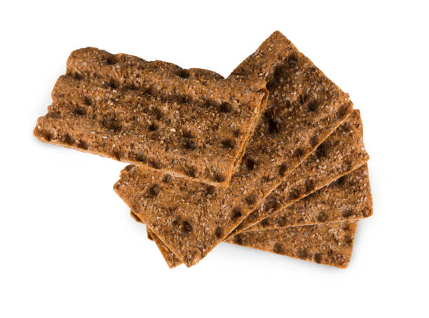 istock Slice of whole grain crispy rye bread isolated on white 868887822