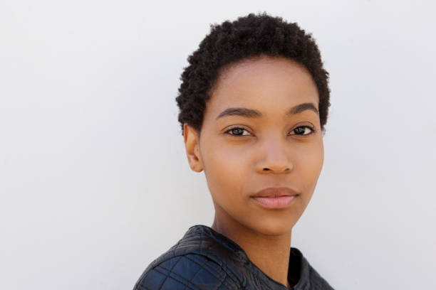 istock beautiful young african woman against white wall 868887862