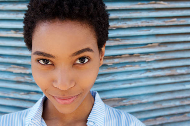istock attractive young black woman smirking 868887958