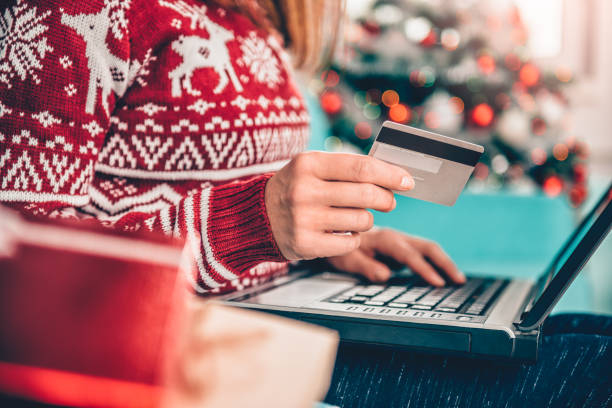 istock Women using credit card at home 868897378