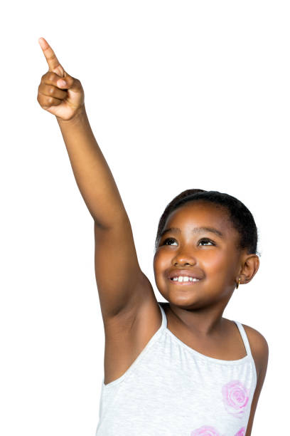 istock Little black girl pointing with finger at corner. 868900154