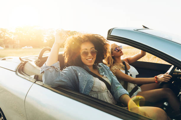istock Girls traveling with car 868900180