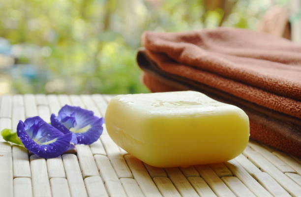 istock soap and towel with blue pea on bamboo mat 868900392