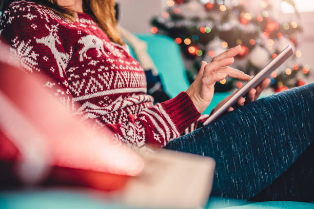 Women using tablet during christmas stock photo