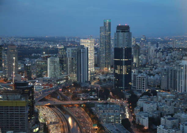 istock Modern cityscape skyline panoramic aerial view night 868900676