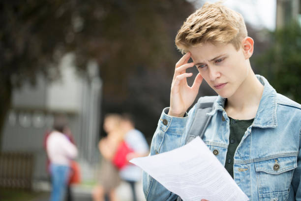Teenage Boy Disappointed With Exam Results Teenage Boy Disappointed With Exam Results only teenage boys stock pictures, royalty-free photos & images