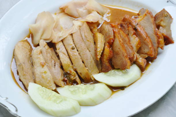 istock roasted duck and sweet barbecue pork in sauce 868900708