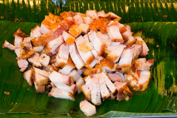 istock Close up Thai roasted crispy pork on banana leaf 868901614