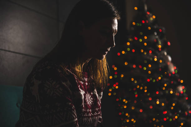 Lonely women sitting at home during christmas