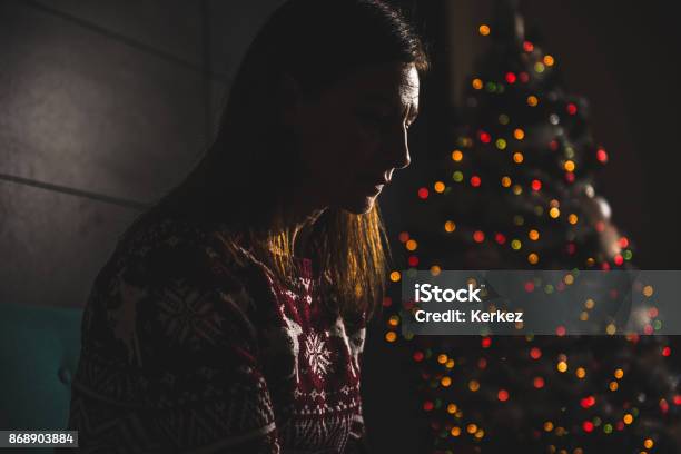 Lonely Women Sitting At Home During Christmas Stock Photo - Download Image Now - Christmas, Sadness, Depression - Sadness