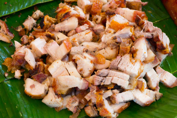 istock Close up Thai roasted crispy pork on banana leaf 868904474