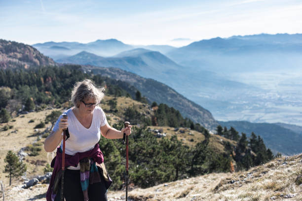 istock Mature Woman Hiking in Mountains 868907434