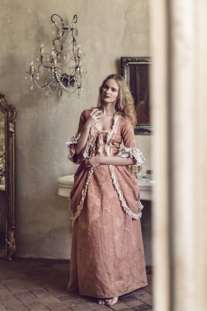 18th century woman in a castle 18th centure woman in a castle applying perfume mirror women baroque style fashion stock pictures, royalty-free photos & images