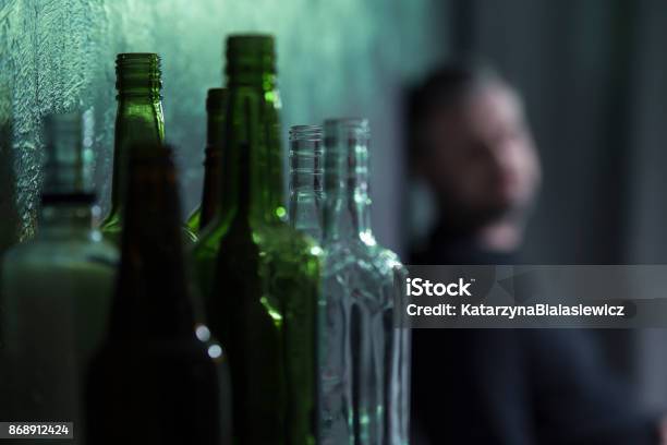 Empty Glass Bottles Stock Photo - Download Image Now - Alcohol Abuse, Men, Addiction