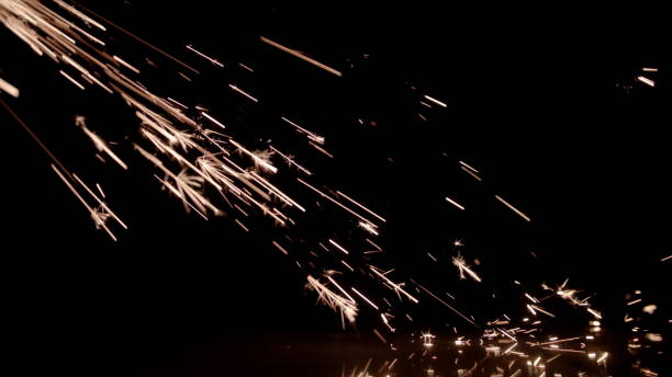 istock Bright Yellow Sparks on a Black Background 868912718